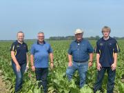 Representatives and FFA members in a field